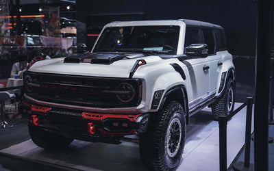Ford Bronco equipped with TAMER4X4 dry carbon fiber hood showing lightweight performance upgrade and OEM+ off-road engineering